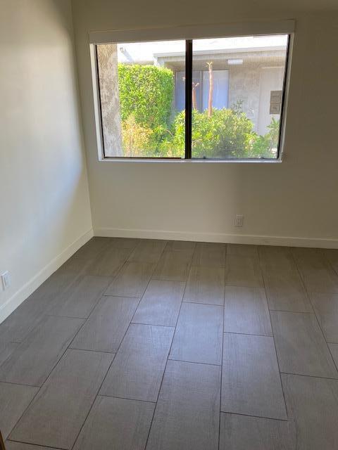 1111 East Ramon Road, Unit 10 Palm Springs, CA 92264 - Photo 17 of 23 an empty room with a window