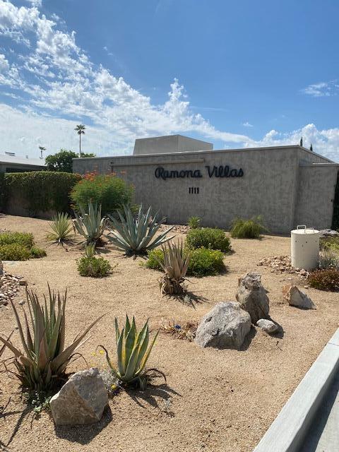 1111 East Ramon Road, Unit 10 Palm Springs, CA 92264 - Photo 20 of 23 a view of a terrace with a table and chairs