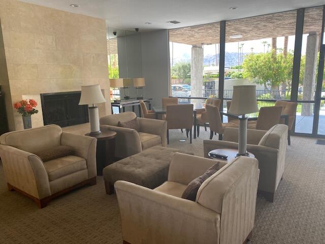 1111 East Ramon Road, Unit 10 Palm Springs, CA 92264 - Photo 22 of 23 a living room with furniture and a large window