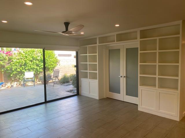 1111 East Ramon Road, Unit 10 Palm Springs, CA 92264 - Photo 6 of 23 a view of an empty room with a sliding door