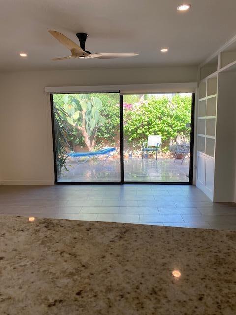 1111 East Ramon Road, Unit 10 Palm Springs, CA 92264 - Photo 7 of 23 a view of empty room with wooden floor and fan