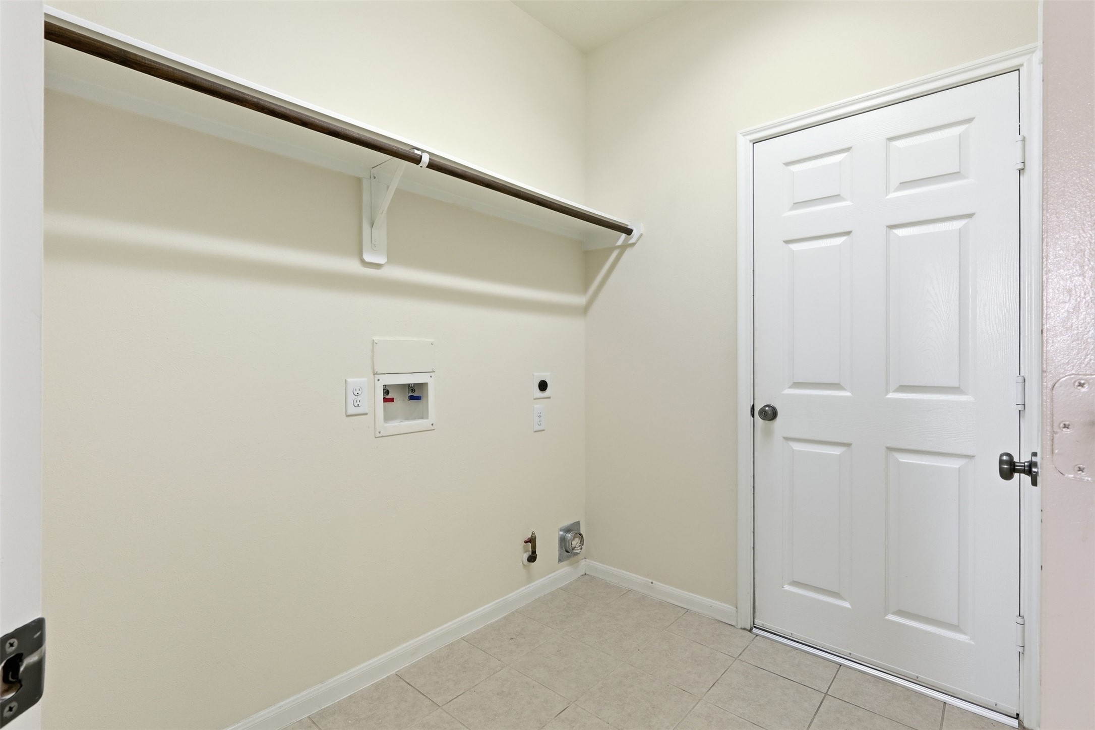 1911 Vale Brook Drive Spring, TX 77373 - Photo 18 of 27 A dedicated utility room offers additional storage and everyday convenience.