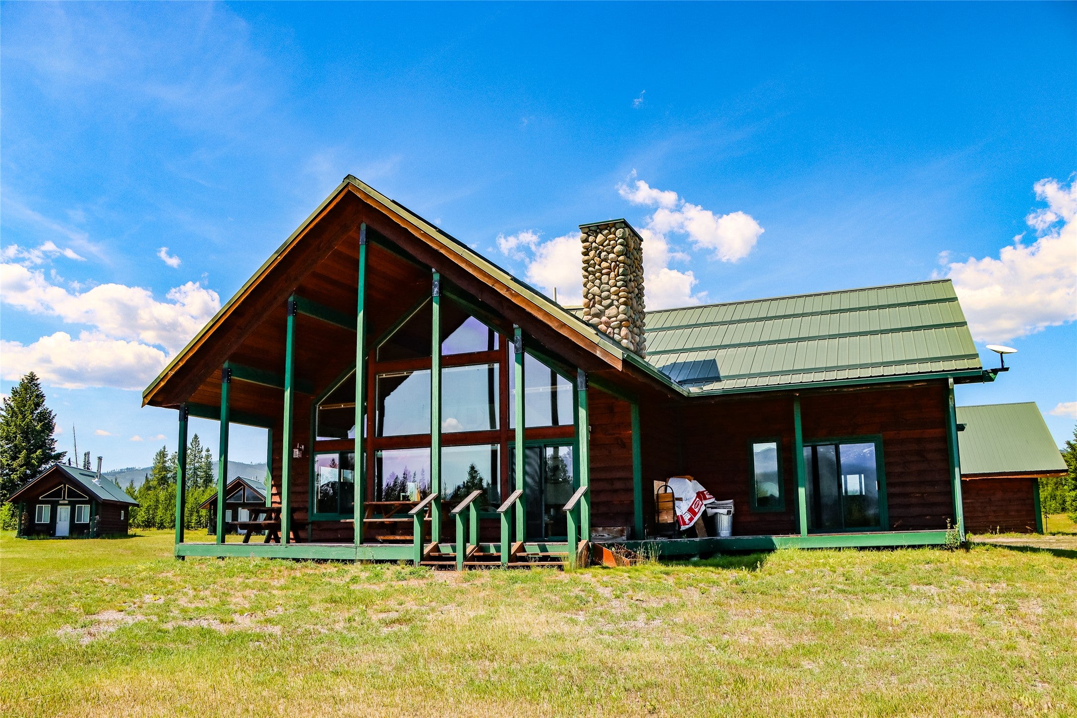 400 Kintla Rnch Road Polebridge, MT 59928 - Photo 1 of 1 Main house with picture windows for perfect viewing of Glacier National Park views