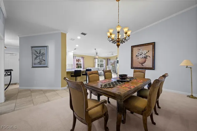 a bedroom with a bed a lamp and a large window