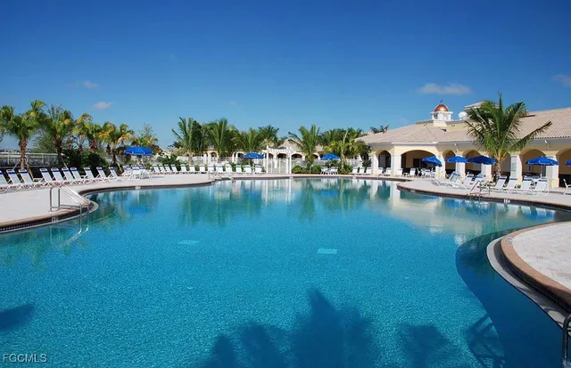 an aerial view of a house with a swimming pool