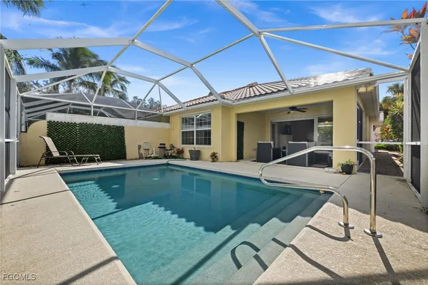 a view of a swimming pool with a patio