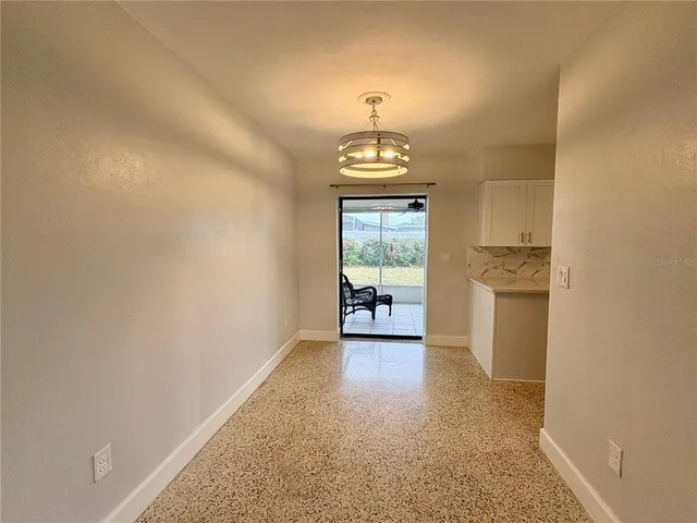 an empty room with a fireplace