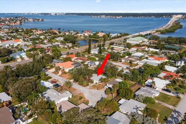 an aerial view of a house with a yard