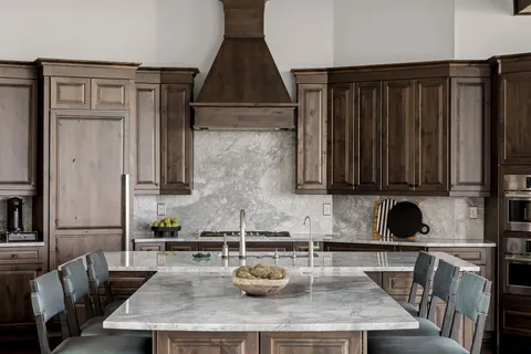 a kitchen with sink and refrigerator