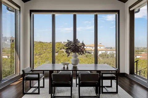a dining room with furniture and window