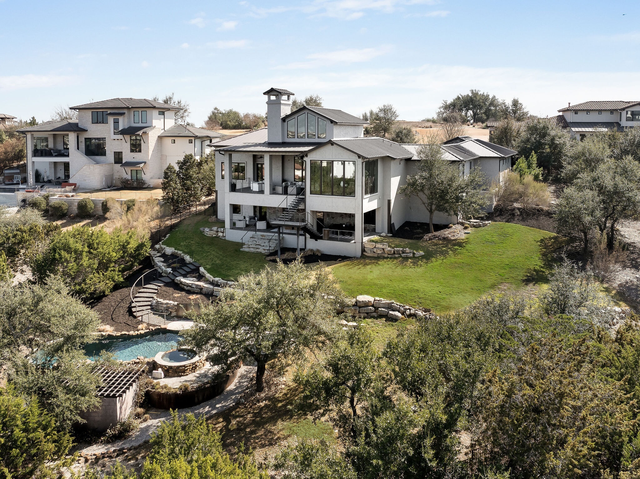 11928 Musket Rim Street Austin, TX 78738 - Photo 2 of 39 a view of a lake with building in front of it