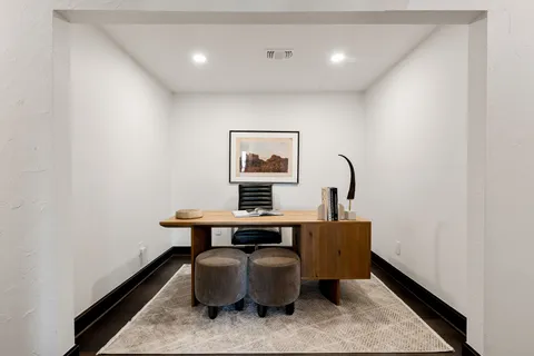 a work room with furniture and window