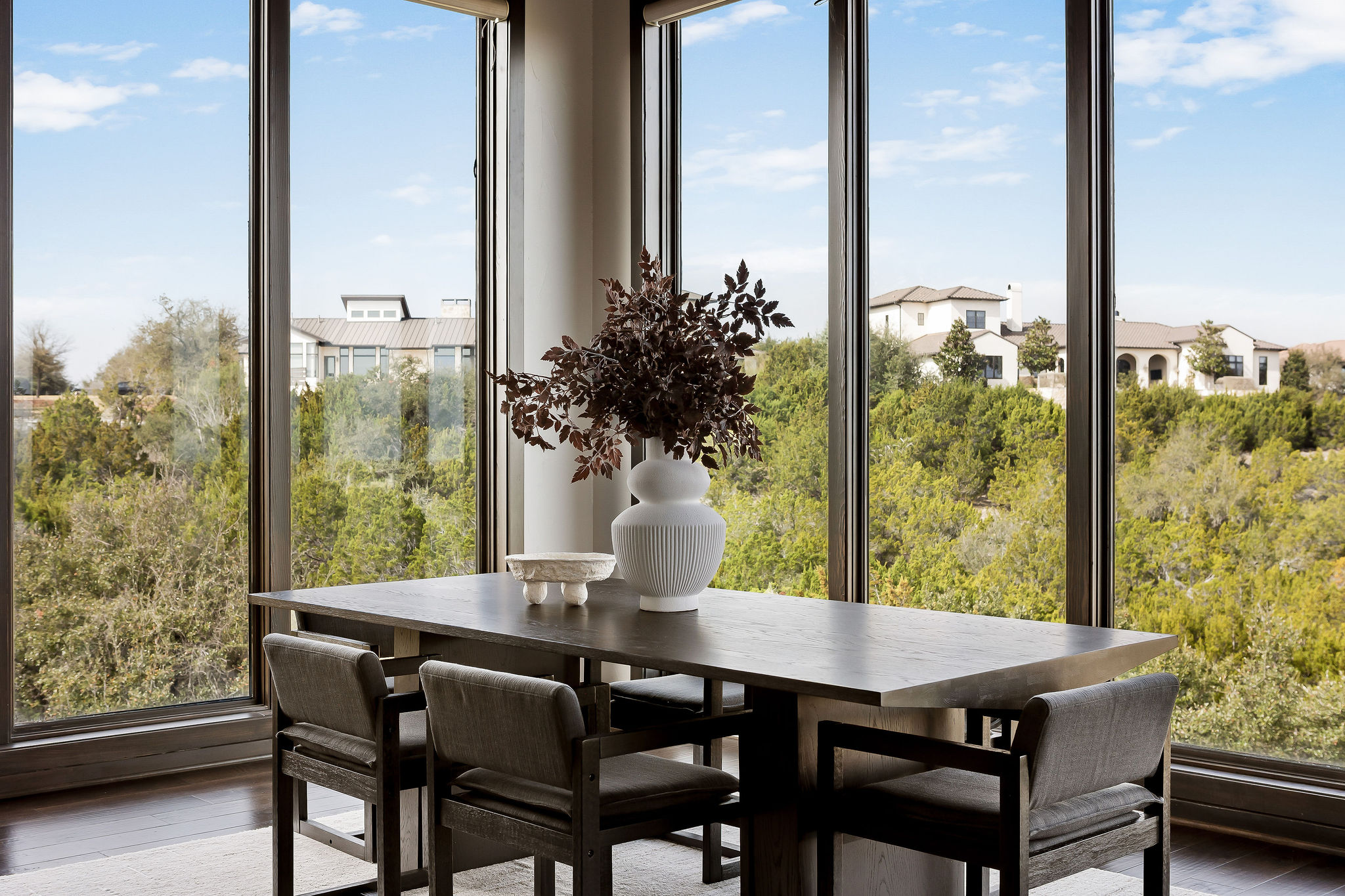 11928 Musket Rim Street Austin, TX 78738 - Photo 4 of 39 a view of a dining room with furniture window and wooden floor