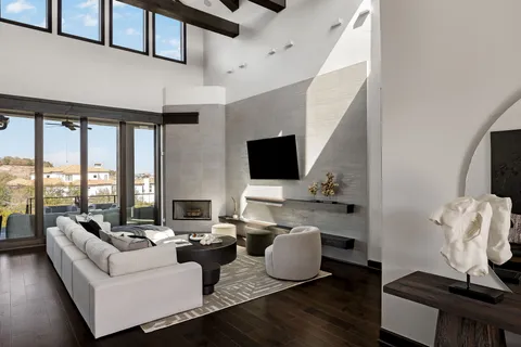 a living room with furniture fireplace and a flat screen tv