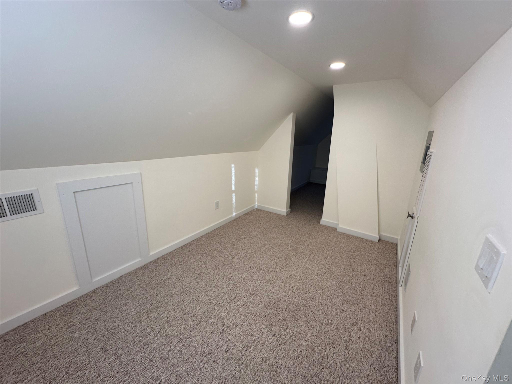 18 West Maple Avenue Suffern, NY 10901 - Photo 17 of 24 Attic for storage with vaulted ceiling, carpet flooring, and recessed lighting