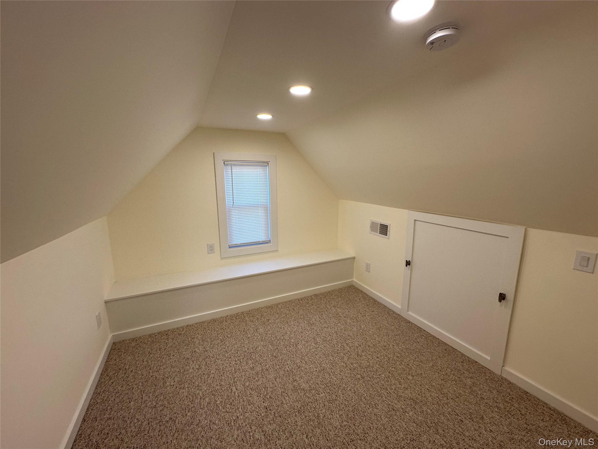 18 West Maple Avenue Suffern, NY 10901 - Photo 18 of 24 Attic for storage with vaulted ceiling, carpet flooring, and recessed lighting