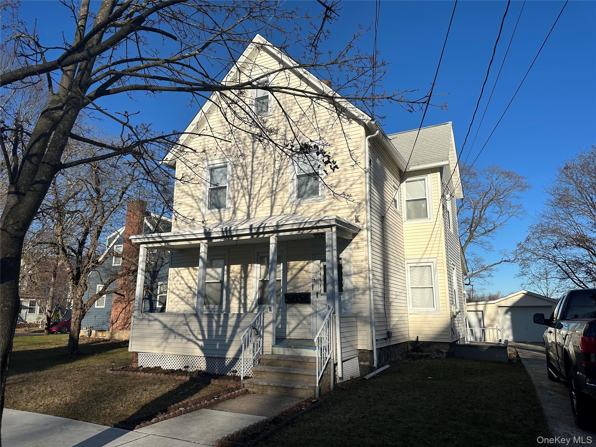 18 West Maple Avenue Suffern, NY 10901 - Photo 2 of 24 Traditional-style house featuring a front yard