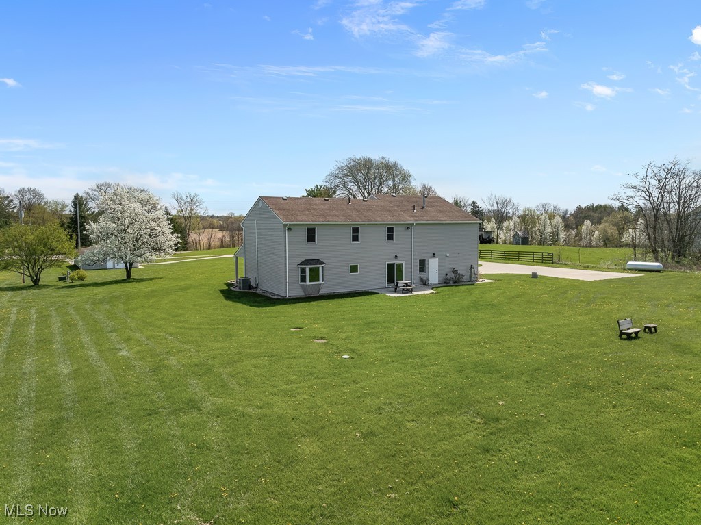 8690 Friendsville Road Lodi, OH 44254 - Photo 42 of 50 Back of house featuring a yard