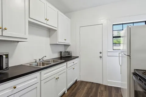 a kitchen with a sink and cabinets