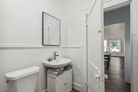 a living room with furniture and a rug