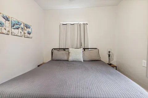 a view of a livingroom with furniture and wooden floor