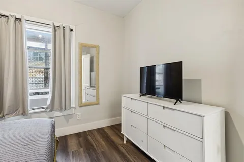 a kitchen with a stove and a refrigerator