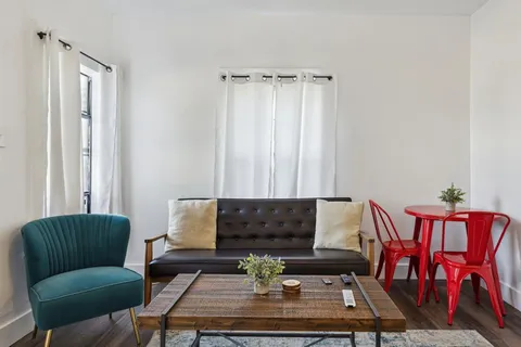 a living room with furniture and a couch