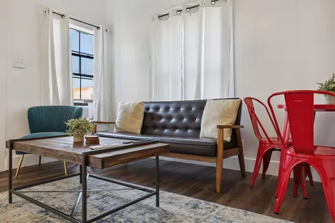a view of a dining room with furniture and window