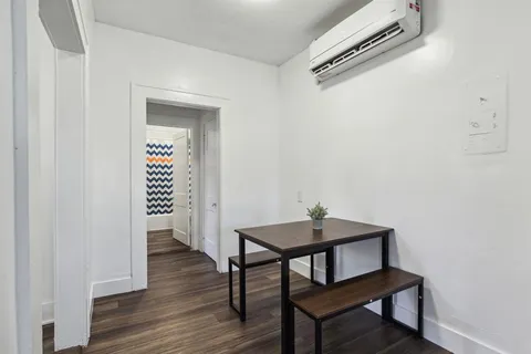 a view of a room that has a table and chair