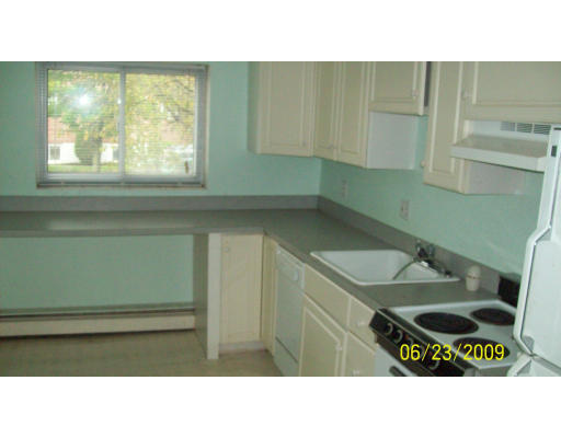 24 Bryon Road, Unit 2 Boston, MA 02467 - Photo 3 of 6 a bathroom with a sink and a mirror
