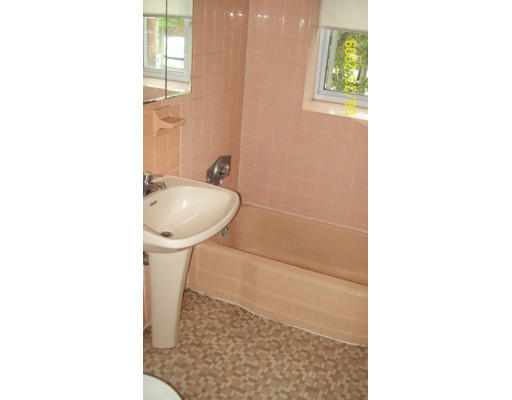 24 Bryon Road, Unit 2 Boston, MA 02467 - Photo 5 of 6 a bathroom with a sink and a mirror
