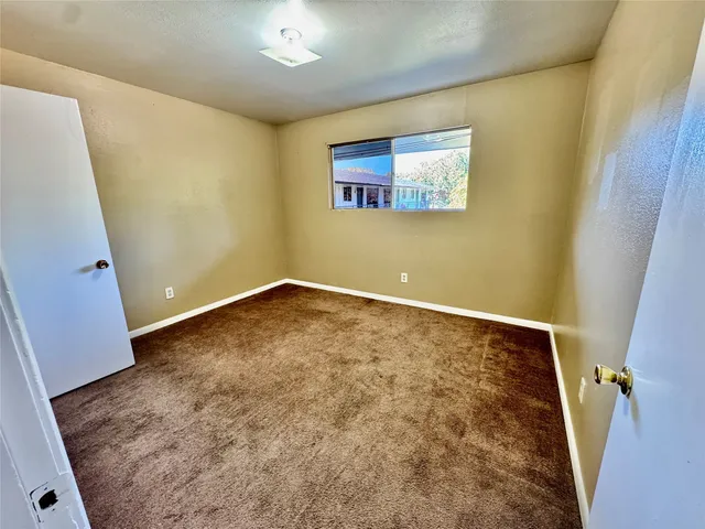 a view of livingroom with hardwood floor and a ceiling fan