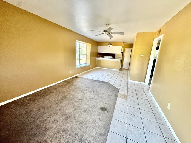 a view of an empty room and window