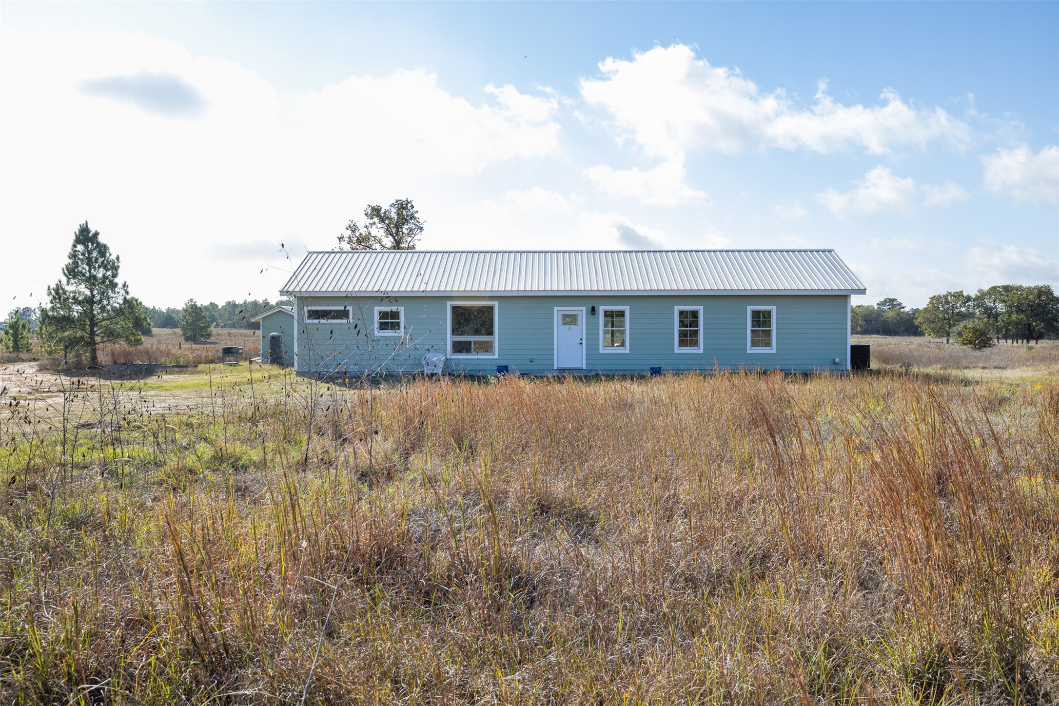1759 Gotier Trace Road Paige, TX 78659 - Photo 25 of 40 a view of house with a yard