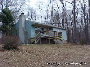 1 Sand Spring Road Cresco, PA 18326 - Photo 1 of 3 a view of a house with a yard