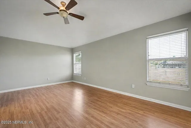 a bathroom with a granite countertop bathtub shower sink and mirror