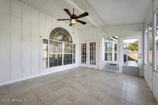 a view of a garden with houses in the background
