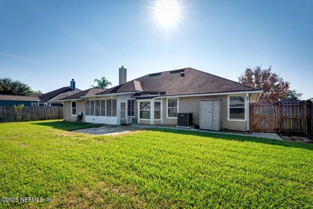 a view of a swimming pool with lounge chairs