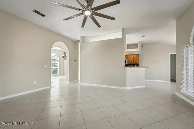 a kitchen with stainless steel appliances a refrigerator and a stove top oven