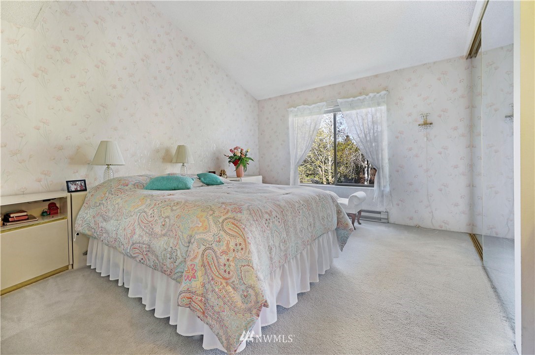 6413 Sand Point Way Northeast Seattle, WA 98115 - Photo 12 of 25 a bedroom with a bed and a window