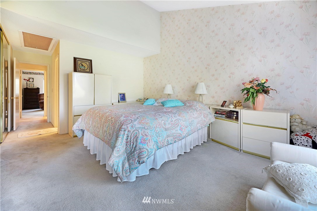 6413 Sand Point Way Northeast Seattle, WA 98115 - Photo 13 of 25 a bedroom with a bed and a couch