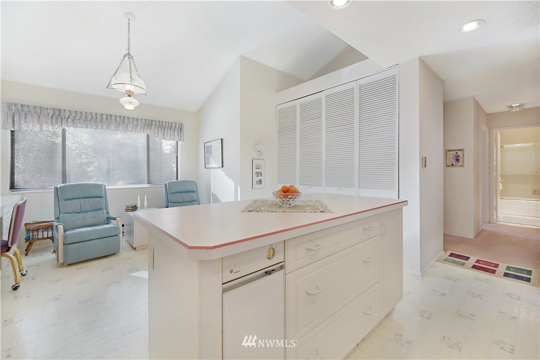 6413 Sand Point Way Northeast Seattle, WA 98115 - Photo 17 of 25 a room with counter space and windows