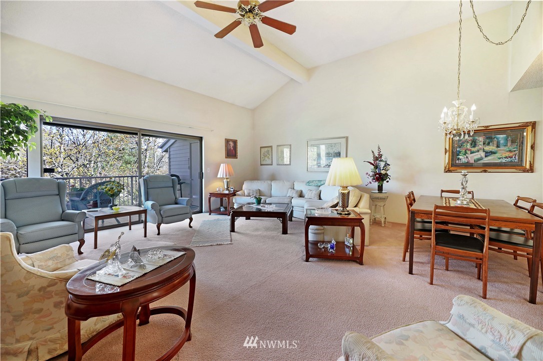 6413 Sand Point Way Northeast Seattle, WA 98115 - Photo 20 of 25 a living room with furniture and a large window