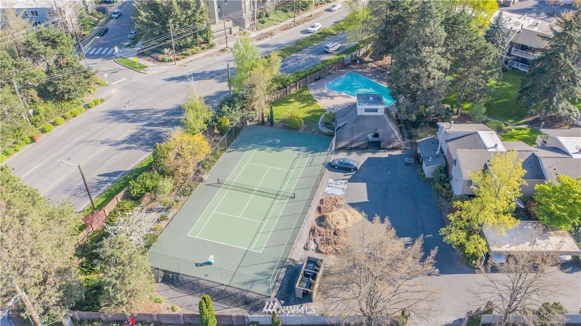 6413 Sand Point Way Northeast Seattle, WA 98115 - Photo 25 of 25 an aerial view of a house with a yard and a large tree