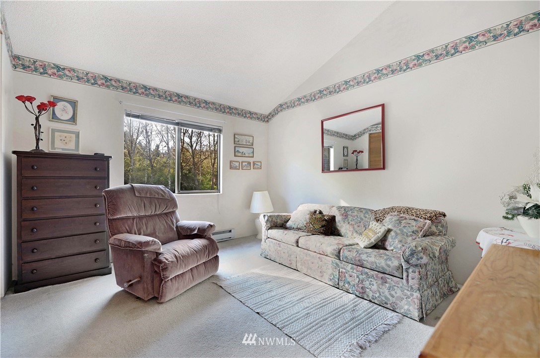6413 Sand Point Way Northeast Seattle, WA 98115 - Photo 5 of 25 a living room with furniture and a window
