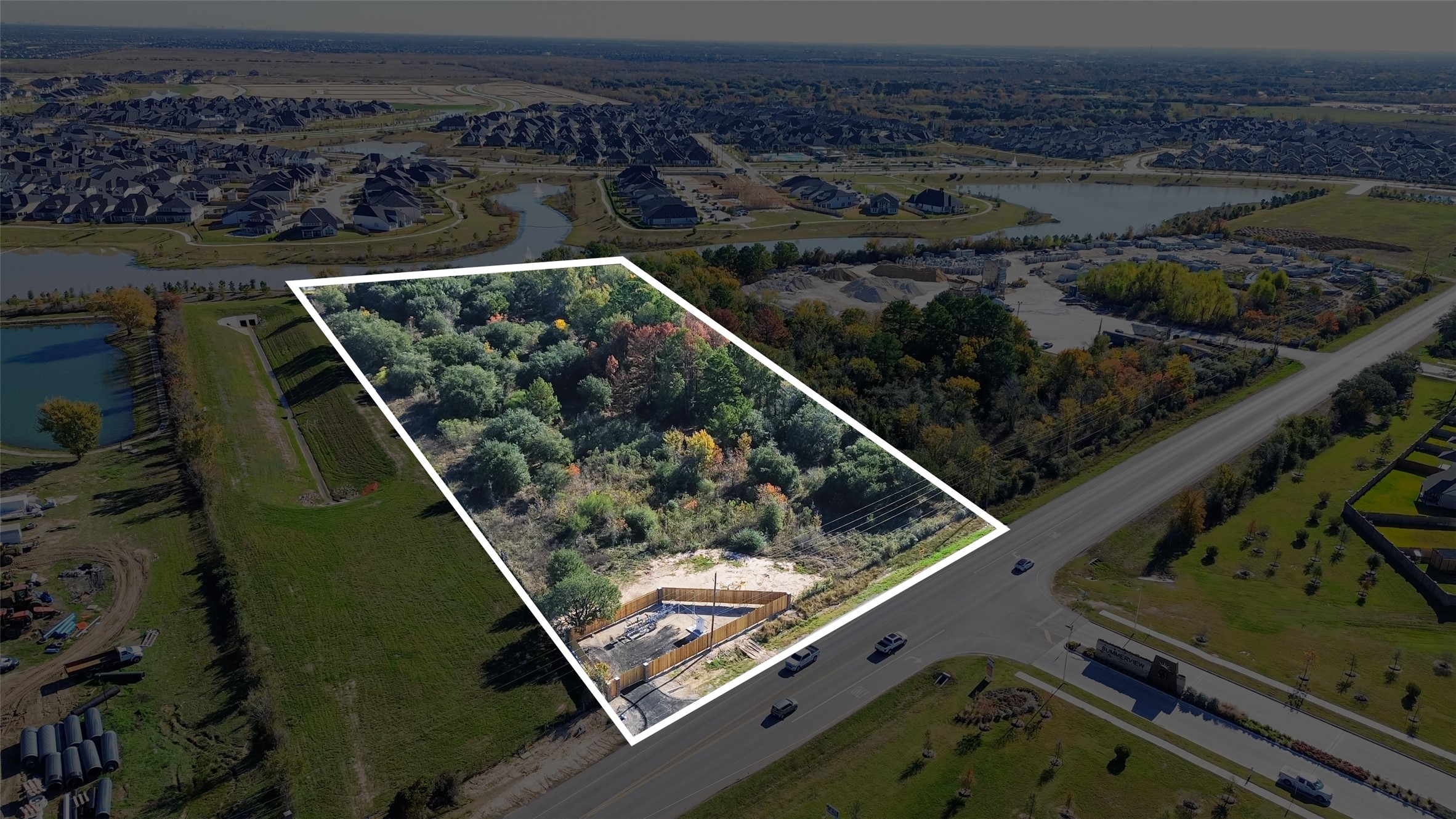 0 Fm-359 Road Fulshear, TX 77441 - Photo 2 of 15 a view of a backyard with wooden floor and a lake view