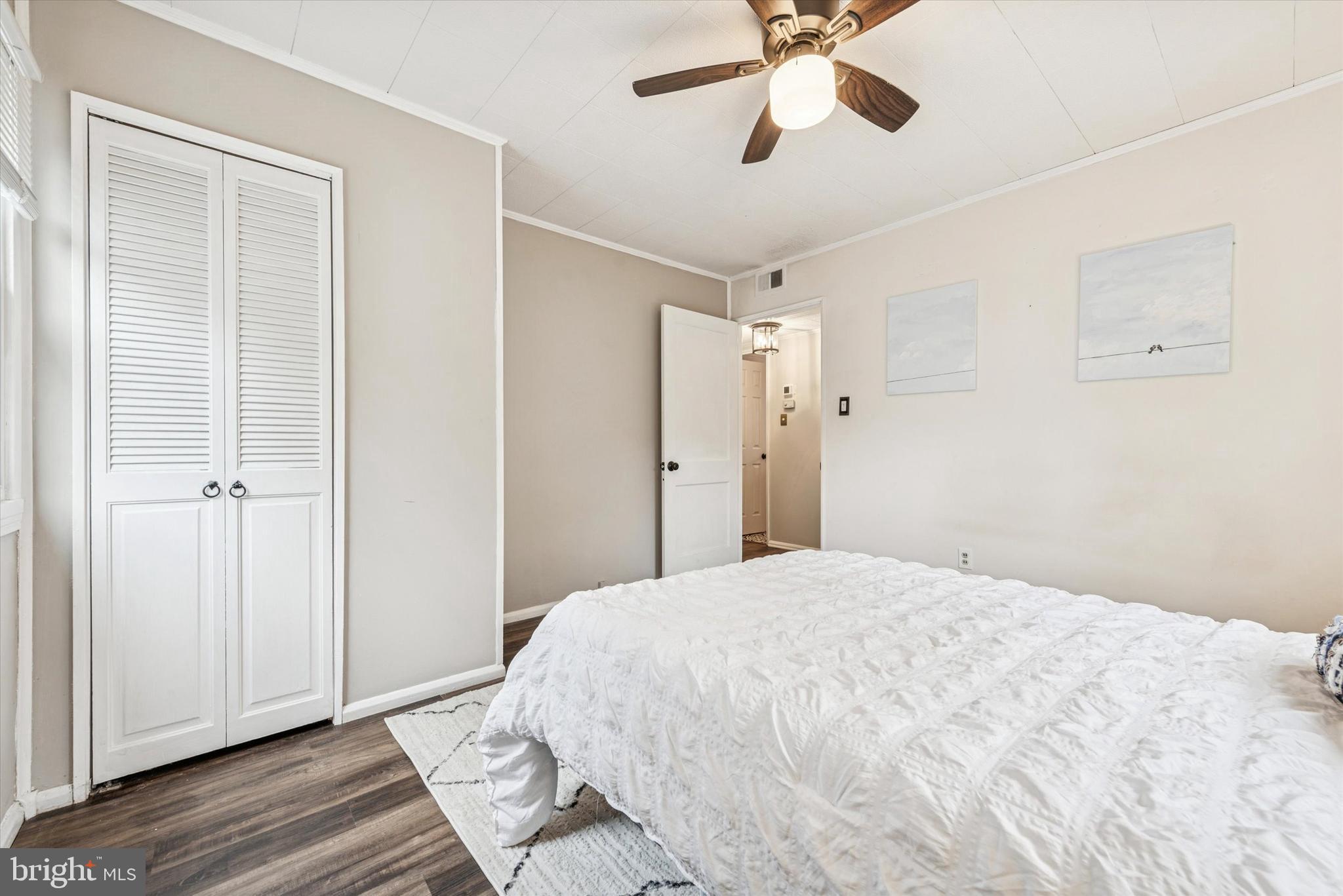 104 Lynbrook Road Paoli, PA 19301 - Photo 11 of 31 a bedroom with a bed and a chandelier
