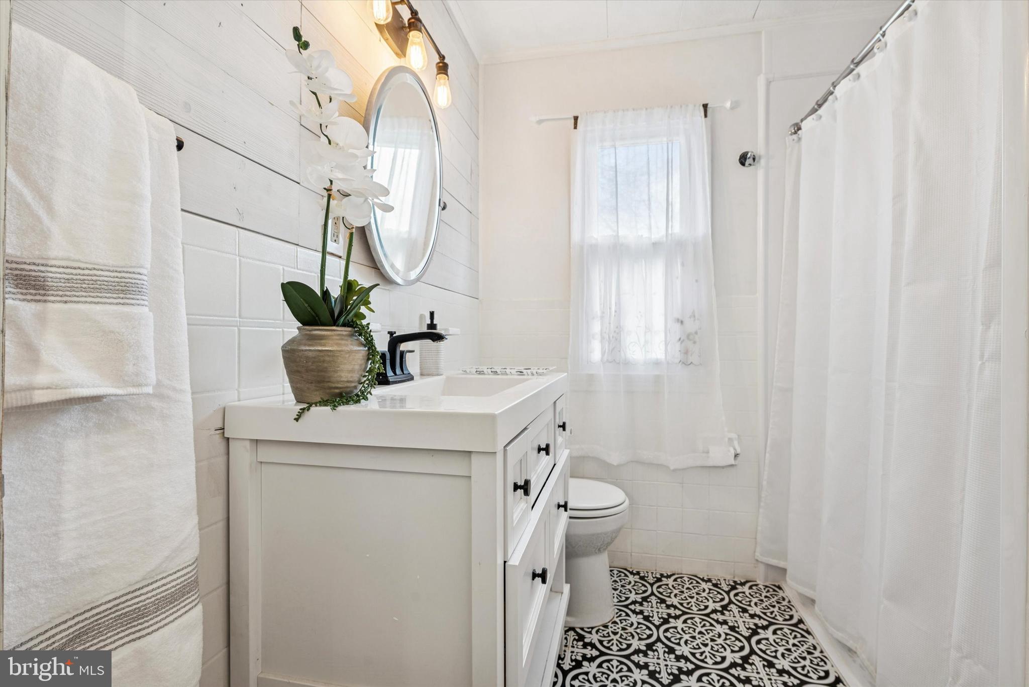 104 Lynbrook Road Paoli, PA 19301 - Photo 12 of 31 a bathroom with a sink a toilet and shower