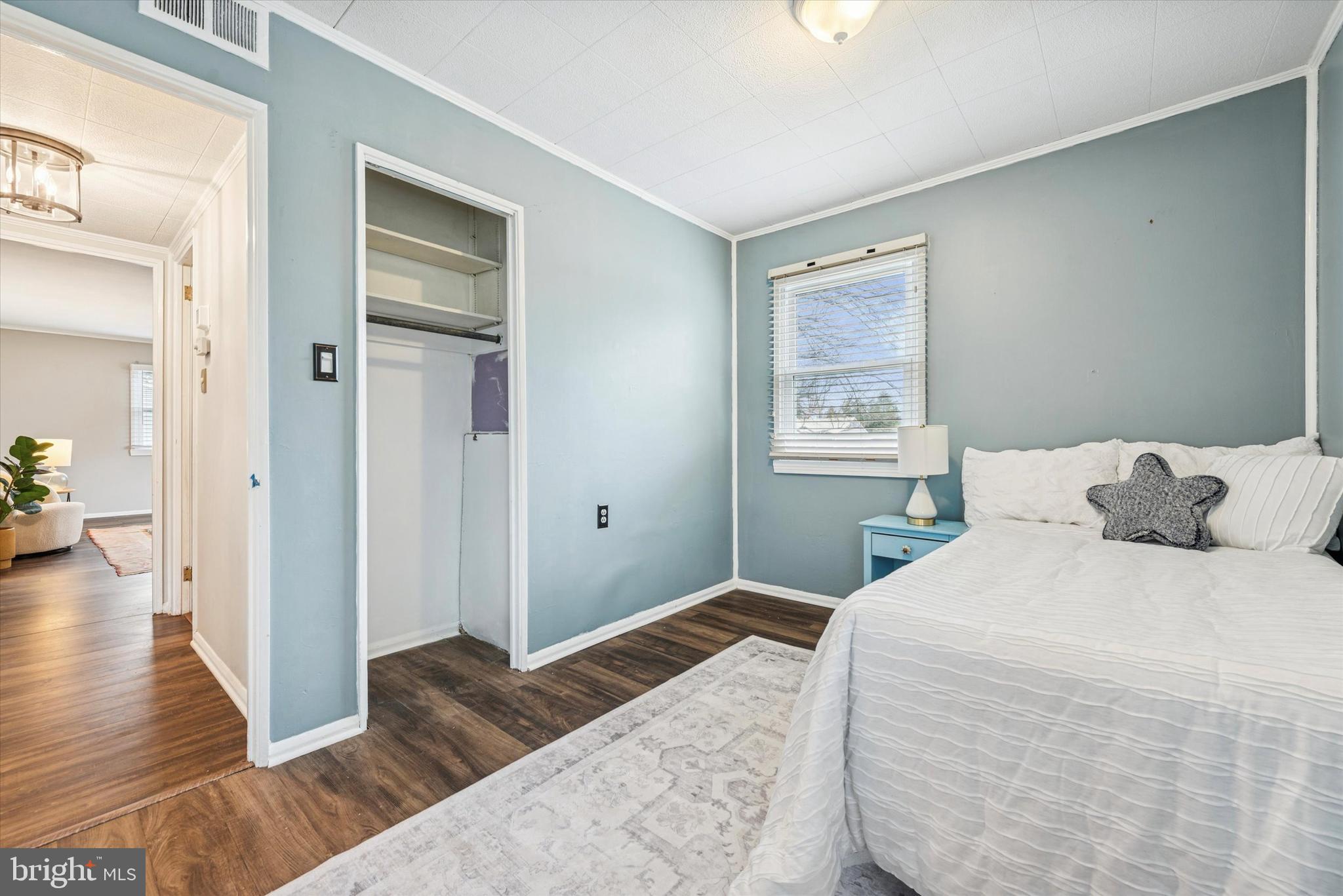 104 Lynbrook Road Paoli, PA 19301 - Photo 15 of 31 a bedroom with a bed and wooden floor