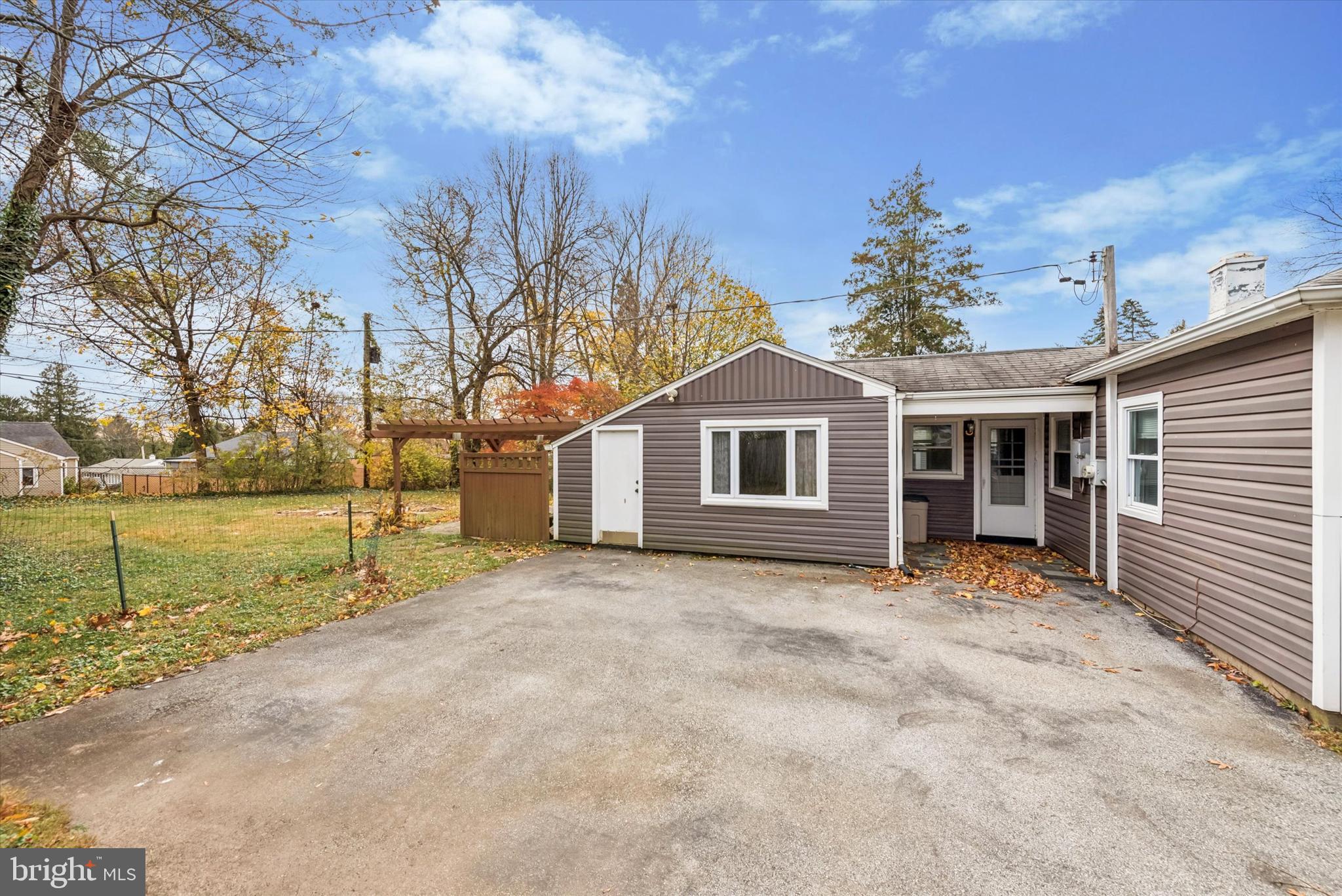 104 Lynbrook Road Paoli, PA 19301 - Photo 29 of 31 a front view of a house with a yard and garage